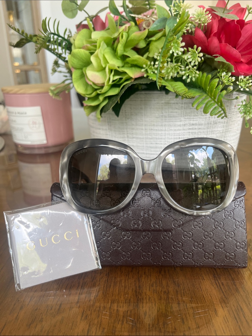Gucci Women’s Round Sunglasses in Gray with Gold Logo